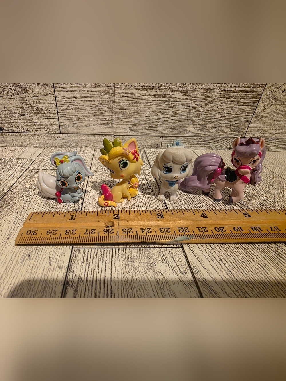 Row of Small Plush-Look Fantasy Pet Figures - Yellow, White, Gray, Purple